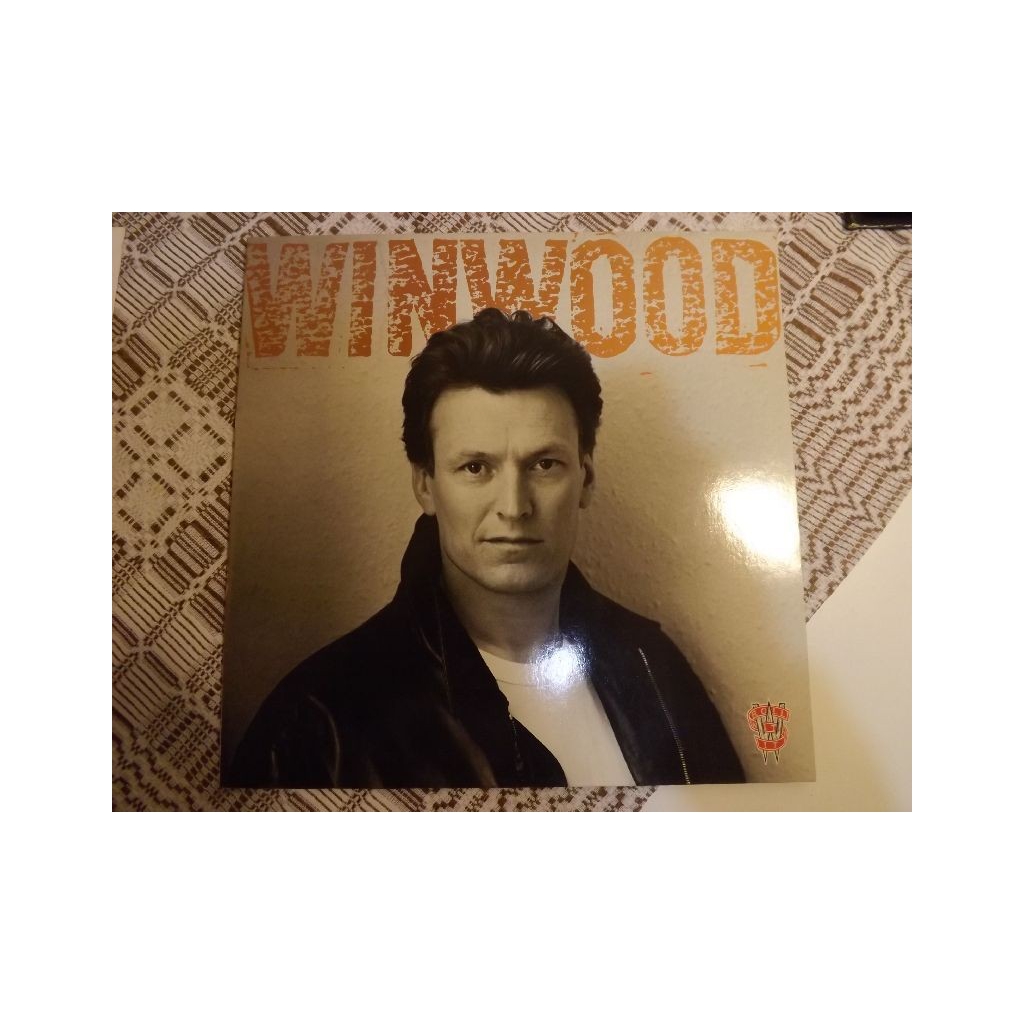 STEVE WINWOOD  ROLL WITH IT